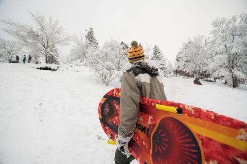 UNH student sledding